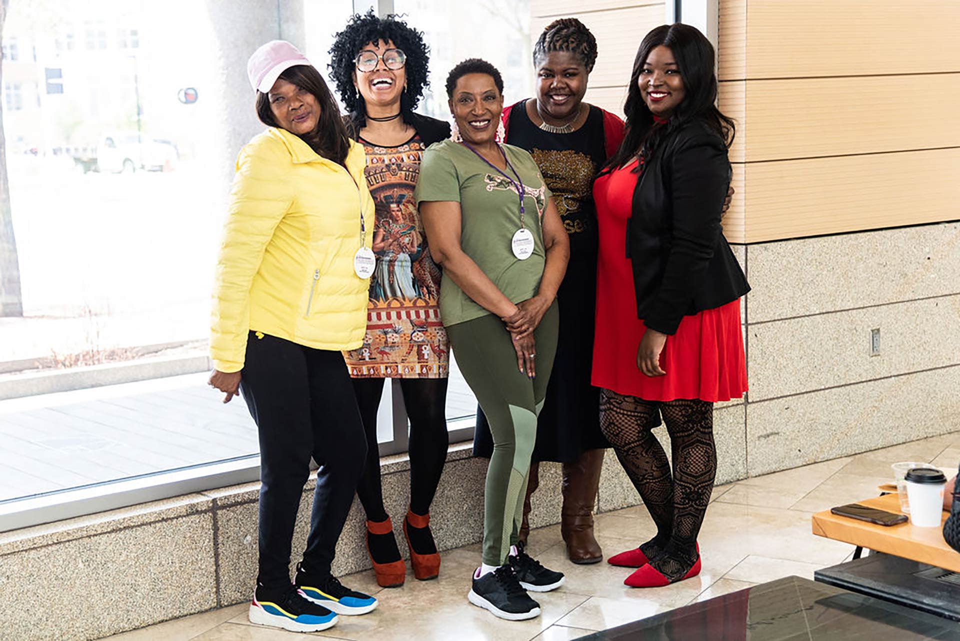 5 women smiling and looking at camera