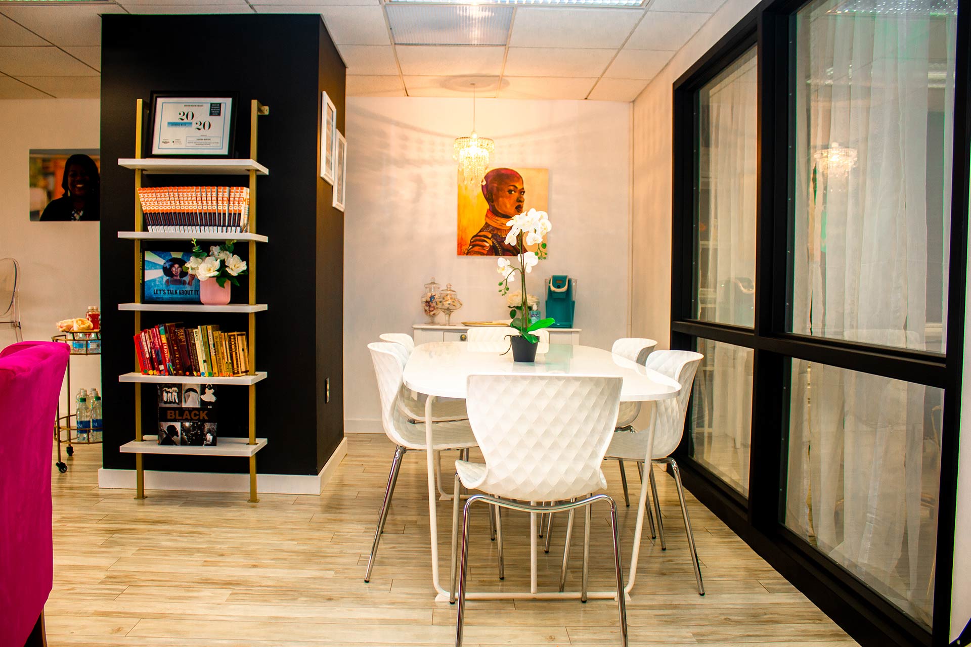 table, chairs, painting in workspace